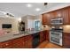 A kitchen featuring wood cabinets, granite countertops, and stainless steel appliances at 3951 Lorien Nw Way, Kennesaw, GA 30152