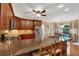 Spacious kitchen with granite countertops, wood cabinets, and stainless steel refrigerator at 3951 Lorien Nw Way, Kennesaw, GA 30152