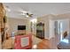 Cozy living room with stone fireplace, hardwood floors, and neutral decor at 3951 Lorien Nw Way, Kennesaw, GA 30152