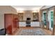 Well-lit office with custom built-ins, hardwood floors, and large window at 3951 Lorien Nw Way, Kennesaw, GA 30152
