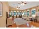 A sun room featuring a sofa, lots of windows, and hardwood floors at 3951 Lorien Nw Way, Kennesaw, GA 30152