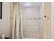 Bathroom with neutral toned shower tiles and decorative glass backsplash at 145 15Th Ne St # 204, Atlanta, GA 30309
