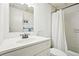 White bathroom featuring a shower with curtain and a white vanity at 145 15Th Ne St # 204, Atlanta, GA 30309