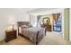 Bedroom features a bed, dresser, large windows with views, and great light at 145 15Th Ne St # 204, Atlanta, GA 30309