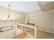 Hallway with pendant lighting and an upper level view of the stairs at 145 15Th Ne St # 204, Atlanta, GA 30309