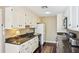 Well-equipped kitchen with white cabinets, granite countertops, and modern appliances, offering a practical cooking space at 145 15Th Ne St # 204, Atlanta, GA 30309