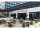 Elegant outdoor seating area with modern furniture and lush greenery, perfect for relaxing or dining at 145 15Th Ne St # 204, Atlanta, GA 30309