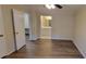 Bright bedroom with light-colored walls, wood-look floors, ceiling fan, and en-suite bathroom at 1701 Augusta Se Dr # 1701, Marietta, GA 30067