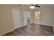 Bright bedroom with light-colored walls, ceiling fan, wood-look floors, and en-suite bathroom at 1701 Augusta Se Dr # 1701, Marietta, GA 30067