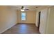 Large bedroom featuring wood-look floors, closet, and updated ceiling fan at 1701 Augusta Se Dr # 1701, Marietta, GA 30067