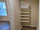 Well-organized closet featuring multiple adjustable shelves with built in bins for storage at 1701 Augusta Se Dr # 1701, Marietta, GA 30067