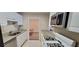 Bright kitchen features white cabinets, granite countertops, and modern stainless steel appliances at 1701 Augusta Se Dr # 1701, Marietta, GA 30067