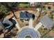 Aerial view of a modern home with a fenced backyard in a cul-de-sac, surrounded by lush greenery at 1732 Red Maple Rdg, Atlanta, GA 30316