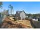 Large backyard features a playset and a wooden privacy fence at 1732 Red Maple Rdg, Atlanta, GA 30316