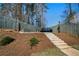 Backyard with stairs leading to an upper seating area with furniture at 1732 Red Maple Rdg, Atlanta, GA 30316