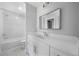 Bathroom featuring a modern vanity, a large mirror, and a shower/tub combo at 1732 Red Maple Rdg, Atlanta, GA 30316