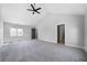 Large bedroom with vaulted ceilings, ceiling fan, and doorway to a bathroom at 1732 Red Maple Rdg, Atlanta, GA 30316