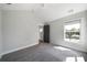 Bedroom with a ceiling fan, plush carpeting, and a window providing ample natural light at 1732 Red Maple Rdg, Atlanta, GA 30316
