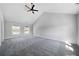 Spacious bedroom with high vaulted ceilings, plush carpeting, and a ceiling fan at 1732 Red Maple Rdg, Atlanta, GA 30316