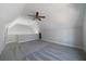 Bright bonus room features vaulted ceilings, ceiling fan, and neutral carpeting at 1732 Red Maple Rdg, Atlanta, GA 30316
