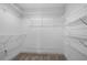 Walk-in closet featuring built-in wire shelving providing ample storage space at 1732 Red Maple Rdg, Atlanta, GA 30316