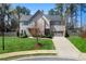 Charming two-story home with a manicured lawn, modern design, and a two-car garage in a suburban setting at 1732 Red Maple Rdg, Atlanta, GA 30316