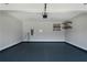 Spacious two-car garage features painted floors and installed shelving at 1732 Red Maple Rdg, Atlanta, GA 30316