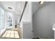 Bright hallway with large windows, hardwood floors, and a staircase at 1732 Red Maple Rdg, Atlanta, GA 30316