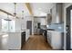 Bright kitchen with stainless steel appliances, a large island, and ample cabinet space with hardwood floors at 1732 Red Maple Rdg, Atlanta, GA 30316