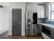 Well-appointed kitchen featuring stainless steel appliances, sleek cabinetry, and a stylish backsplash at 1732 Red Maple Rdg, Atlanta, GA 30316