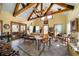 Bright and airy living room with high ceilings, wooden beams, and lots of natural light at 680 Milligan Creek Rd, Roopville, GA 30170