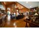 Cozy living room with wood-paneled walls, brick chimney, and hardwood floors at 680 Milligan Creek Rd, Roopville, GA 30170
