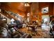 Open-concept living room with wood-paneled walls, brick fireplace, and staircase at 680 Milligan Creek Rd, Roopville, GA 30170