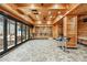 Entertaining space with a full bar, wood accents, and access to outdoor living space at 8069 Kenstone Ct, Sandy Springs, GA 30350