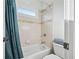 Cozy bathroom features shower-tub combination with blue shower curtain at 8069 Kenstone Ct, Sandy Springs, GA 30350