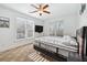 Bright bedroom with natural light, ceiling fan, and neutral décor for a relaxing atmosphere at 8069 Kenstone Ct, Sandy Springs, GA 30350