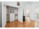 Spacious walk-in closet with custom shelving and drawers at 8069 Kenstone Ct, Sandy Springs, GA 30350
