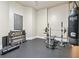 Well-equipped exercise room with rubber flooring, free weights, and punching bag for a complete workout at 8069 Kenstone Ct, Sandy Springs, GA 30350