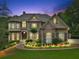 Charming home featuring stone accents, manicured landscaping, and inviting front entrance at 8069 Kenstone Ct, Sandy Springs, GA 30350