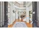 Grand two-story foyer with hardwood floors, elegant staircase, and an open, airy layout at 8069 Kenstone Ct, Sandy Springs, GA 30350