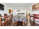 Spacious game room with a covered pool table, bar area, and hardwood floors, perfect for entertainment at 8069 Kenstone Ct, Sandy Springs, GA 30350