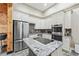 Stylish kitchen with stainless steel appliances, granite countertops, and custom white cabinetry at 8069 Kenstone Ct, Sandy Springs, GA 30350