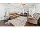 Inviting living room featuring hardwood floors, comfortable seating, and natural light at 8069 Kenstone Ct, Sandy Springs, GA 30350