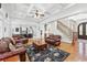 Open-concept living room with coffered ceilings, staircase and view of the kitchen at 8069 Kenstone Ct, Sandy Springs, GA 30350