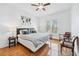 Well-lit main bedroom with hardwood floors, furnishings and ensuite access at 8069 Kenstone Ct, Sandy Springs, GA 30350