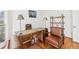 Office featuring a wood desk, matching chairs, and a metal shelf with a wood top at 8069 Kenstone Ct, Sandy Springs, GA 30350