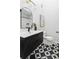 Modern bathroom featuring black and white geometric tile floors, a sleek black vanity, and arched mirror at 210 Trailmore Ct, Roswell, GA 30076