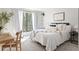 Relaxing bedroom with a dedicated desk space, bright window, and comfortable furniture at 210 Trailmore Ct, Roswell, GA 30076