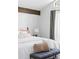 Comfortable bedroom with exposed beam, neutral color scheme, and window with natural light at 210 Trailmore Ct, Roswell, GA 30076