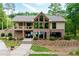 Beautiful clubhouse with a stone facade, large windows and ample community space at 210 Trailmore Ct, Roswell, GA 30076